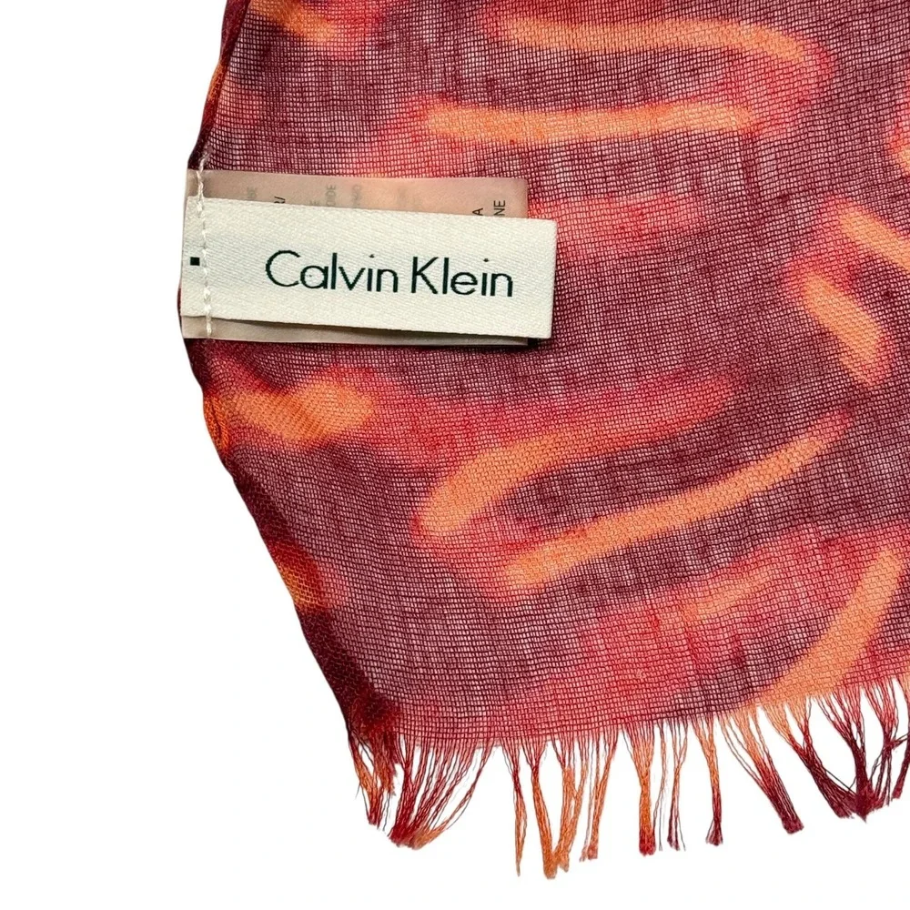 Calvin Klein Lightweight Scarf Red Orange Pattern Fringe Hem Gold Logo Charm